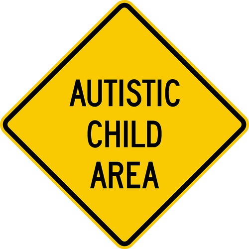 Yellow Sign with black text Autisti Child Area