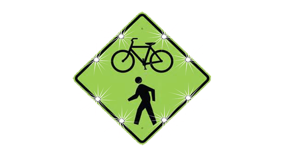 yellow sign with lights and silhouette of man and bike