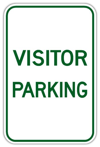 white sign with green text that states Visitor Parking